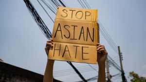 Police join communities across the U.S. to fight back against anti-Asian hate crimes