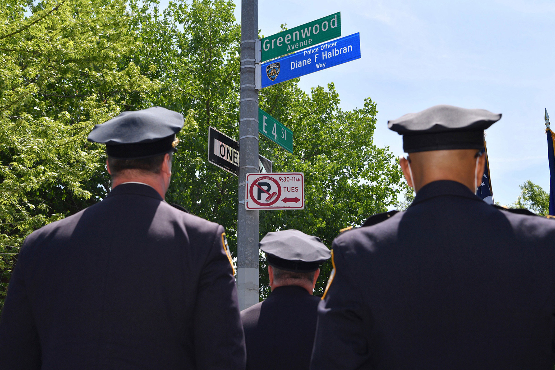 diane-halbran-street-renaming-3-Police-stand-near-the-sign-during-the-street-renaming-ceremony