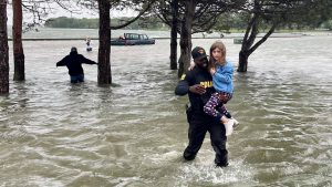 Officer rescues family trapped in flooded car