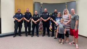 Oshkosh police officers react quickly to rescue family from house fire