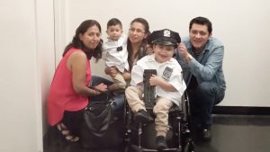7-year-old honorary NYPD cop with rare genetic condition released from hospital to applause from officers