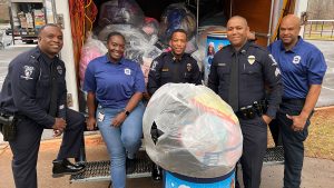 N.O.B.L.E. Charlotte police officers donate winter coats to those in need this holiday season