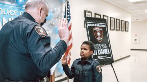 Boy fighting cancer sworn in as honorary police chief of Houston ISD