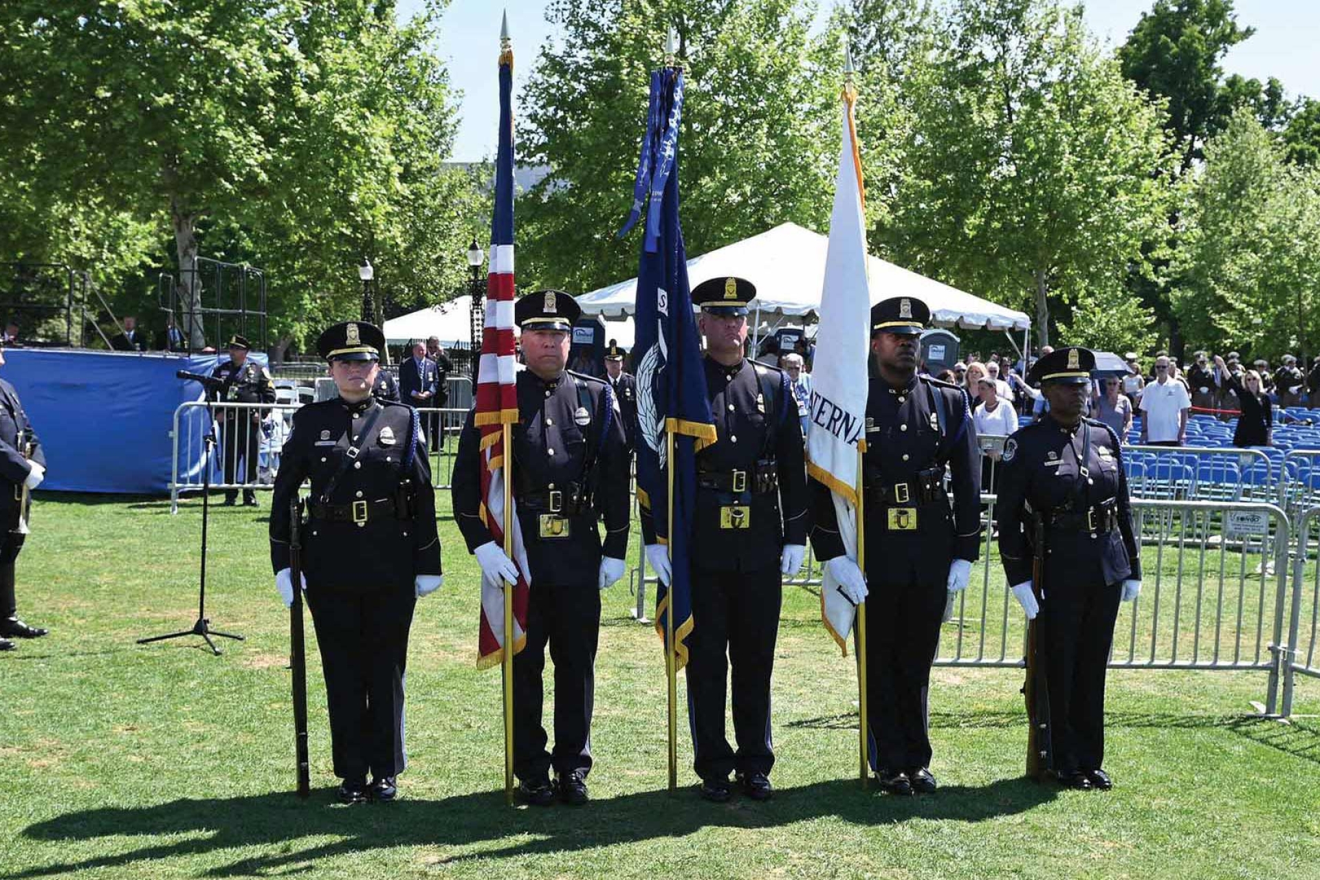 national-police-week-2022-10-an-honor-guard-stands-at-attention-at-the-memorial-service