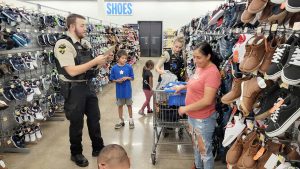 S.D. officers help at-risk youth prepare for new school year with “Shop With a Cop” event