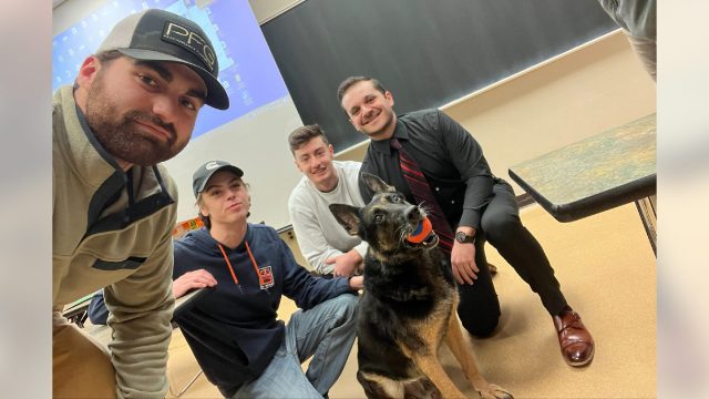 Police K-9 comforts Michigan State University students returning to class after campus mass shooting