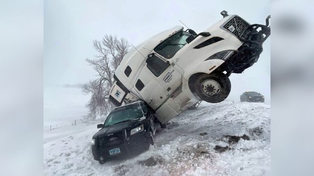 Semi-truck collides with South Dakota police cruiser during winter storm