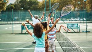 “Tennis brings us all together”: NYPD officers bond with youth through community tennis program