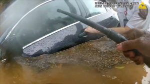 Atlanta police officer and fire rescue captain save trapped driver during flash flooding