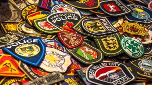 Young law enforcement enthusiast collects patches from agencies across the globe